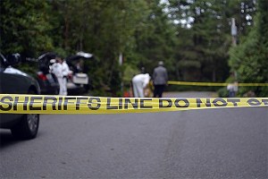 Two bodies were found at the Rhododendron Mobile Home Park on Sept. 15. The site was taped off as forensics worked in the background.