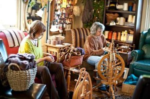Two women enjoy the atmosphere of the ‘Cozy Corner’ in The Artful Ewe in Port Gamble.