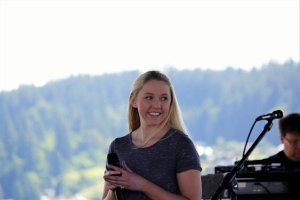 Rachel Clemons of North Kitsap High School is applauded after her performance of the National Anthem