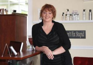 Elizabeth Brooling stands at the front counter of her new shop