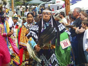Powwow participants danced in traditional regalia Aug. 16 in front of the House of Awakened Culture. Dancers competed in Fancy