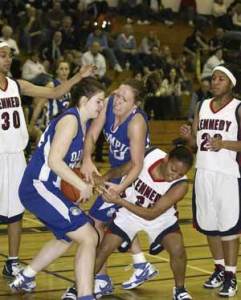 Olympics Samantha Thornton pulls down the loose ball in front of teammate Nicole Buhl (20) and a Kennedy player in what would be a fast-paced game.