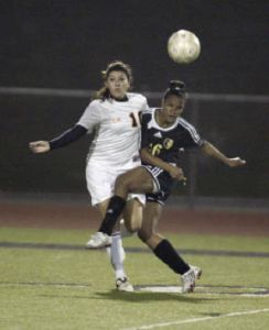 Central Kitsap’s Rebekah Kitchen fights for position against a Lincoln defender Tuesday. The Lady Cougars won the game 6-1.