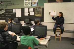 Klahowya Secondary School teacher Danyell Laughlin teaches vocabulary lessons to a seventh grade reading class Wednesday. Laughlin used donorschoose.org to pay for new novels for her classroom.