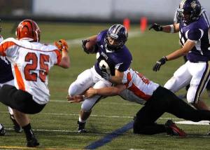 The North Kitsap Vikings took on the Tigers in non league play Friday at North Kitsap Stadium.  Vikings running back Khody Golden finds the hole in the Tigers line.