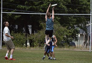 Chris Mueller (in white) watches as his teammate