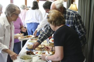 Seniors spend time laughing and talking at a recent meeting of the Kitsap Senior Singles group. The group is open to all seniors and many members said the events are a great way to have fun and meet other single seniors.