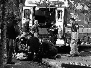 Medics care for a 14-year-old who was struck Monday by a pickup while riding her bike on Clear Creek Road.