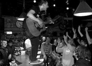 Greg Rekus performs “punkoustic” music with an acoustic guitar