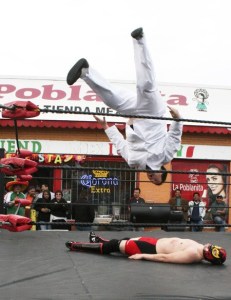 The Chef flies off the top rope in a match against Diamond Timmy Reed Thursday night at La Poblanita in Bremerton. The wrestling match marked Cinco de Mayo at the Mexican grocery store and restaurant.