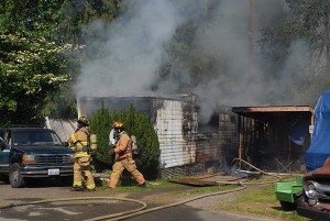 Firefighters respond to a fire at Rocky Point Mobile Home Park on April 21.