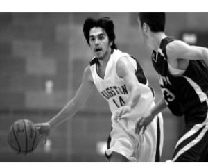 KHS junior Aaron Lawrence takes control Tuesday  night and blows past an Eagle defender. Lawrence had four points and played aggressive ball all night long. Klahowya took the game