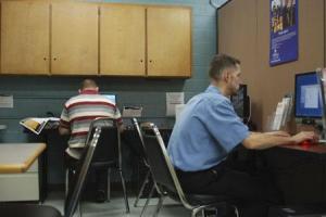 Randall Burgess uses one of the computers available to veterans at the new Olympic College Veterans and Military Support Center Oct. 3