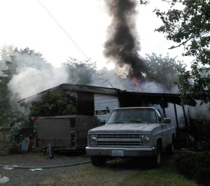 North Kitsap Fire and Rescue crews put out a fire at a double-wide trailer in Kingston on July 3.