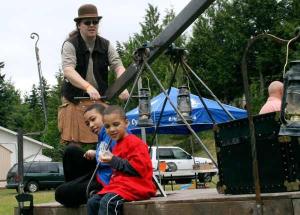 Matthew Dockrey of Seattle pumps his kinetic handcar across the lawn at Poulsbo Seventh-day Adventist Church June 10 during the second Kitsap MiniMaker Faire.