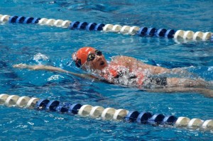 Central Kitsap High School sophomore Liane Hirata swims the 100-yard backstroke during Central Kitsap’s 127-56 loss against Bainbridge High School on Tuesday.