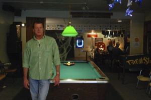 Mike Hake stands in the lounge of American Legion post 149 on the afternoon of Monday