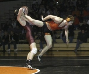 South Kitsap’s Brady Zurn upends Central Kitsap’s Connor Worthington en route to an 8-1 victory in Wednesday night’s dual match.