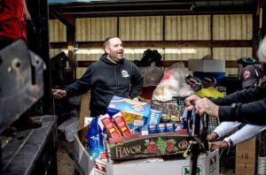 Non-perishable food is loaded into a truck for delivery to Central Kitsap Food Bank after Sugar Shack Espresso raised more than 3