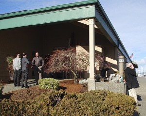 Employees from Kitsap Bank's Bay Street branch wait outside for the ok to reenter the building after smoke filled the interior. South Kitsap Fire and Rescue and Port Orchard Police responded to the scene. No damage was reported. Work being done on the building's HVAC system caused smoke to emanate from the venting.