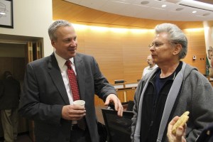 Port Orchard Police Chief Alan Townsend meets a Poulsbo resident at an open house Wednesday