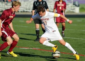North Kitsap's Daniel Norberg attempts to break through the defense of Kingston's Nick Boles May 8 during the Olympic League playoff game at North Kitsap Stadium. North Kitsap won 2-0