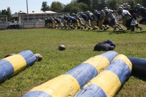 The Bremerton High School football team runs prints during practice Wednesday