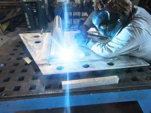 Richard Irvin welds up the rudder for a modern high speed ferry for San Francisco Transit. The company also makes Napoleonic-era bronze field cannons.