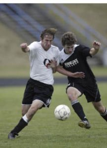OC freshman Jereme Huesche battles a Highline defender during a 4-0 loss Wednesday.