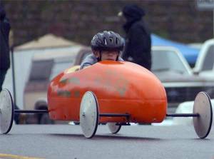 Julian Myrick races down Dauntless Drive NW in Poulsbo during the first day at the All-American Soap Box Derby Rally.