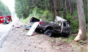 The driver of a 2003 Ford F-250 pickup truck was killed when it veered off J.M. Dickenson Road SW and crashed into two large trees. The roadway is in South Kitsap.