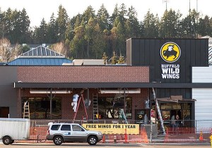 Workers put the finishing touches on a new Buffalo Wild Wings at the Kitsap Mall on Jan. 20.