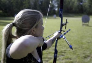 16-year-old Central Kitsap student Lauren Hughes takes aim during a practice at Kenmore Gun Range in Bothel. Hughes hopes to qualify for the 2012 Olympics in London in archery. She has already won a handful of competitive events.