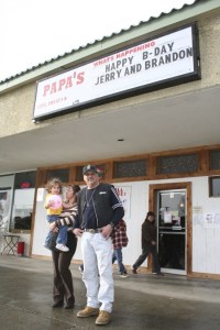 Lisa and Tom Arnold play with their granddaughter