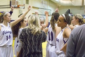 The NK girls basketball team cheers for a win in a league match against Olympic on Jan. 19. The Viking girls ended their post season play at regionals on Feb. 26.