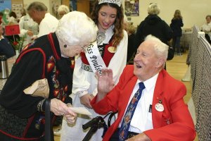 Valborg ‘Volly’ Grande and Earl Hanson greet each other at the 100th annual lutefisk dinner at Poulsbo First Lutheran Church