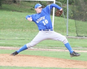 Olympic High School senior Riley Crow throws a pitch during the Trojans' 3-0 loss to North Kitsap High School on Wednesday.