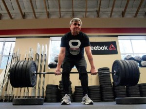 Dave Lonergan lifts through a workout at the Agate Pass Crossfit gym.
