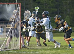 Klahowya's Justin Anderson takes a shot during the first-round playoff game against Inglemoor High School at Klahowya High School May 13. The shot was blocked