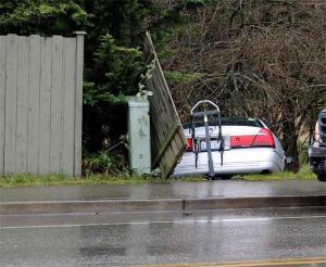 A four-door sedan crashed into a fence on Lincoln Road about noon Friday.