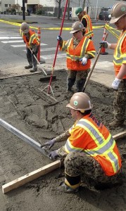 Seabees work on potholes on roads on Naval Base Kitsap Bremerton.