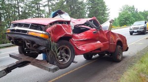 Red Chevrolet truck on SR16.