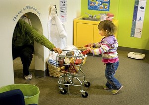 A young child explores the 'Old Town' exhibit at KiDiMu.