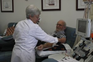 Kristin Okinaka/staff photo Sharon Metcalf gets Leonard Newsom of East Bremerton ready to donate blood at Puget Sound Blood Center’s Silverdale location last week. Newsom