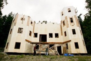 Home builder James Hauf (left) and helper Rod Wilker are constructing a 4