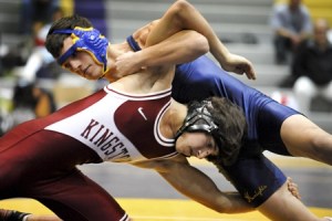 Kingston High wrestler Sam English grapples with Bremerton's Spencer Banks during Tuesday's takedown tournament at North Kitsap High School.