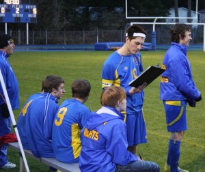 Bremerton High School junior forward Nick Riders scans game notes during the Knights’ 5-1 win at North Mason High School Monday night. The team