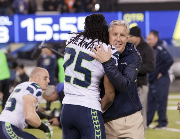 Seattle Seahawks Coach Pete Carroll embraces Richard Sherman at Super Bowl XLVIII