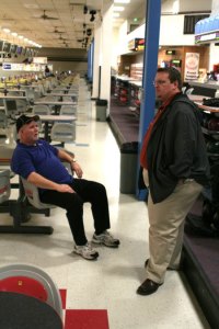 Olympic High School bowling coach Dave Colby (left) and Bremerton High School bowling coach Dean Wagner have a discussion following Monday's practice at All Star Lanes.