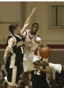 OC’s Duntae Jones (right) wraps a pass around a Peninsula defender during the Rangers’ 76-75 loss at the Bremer Center Wednesday.